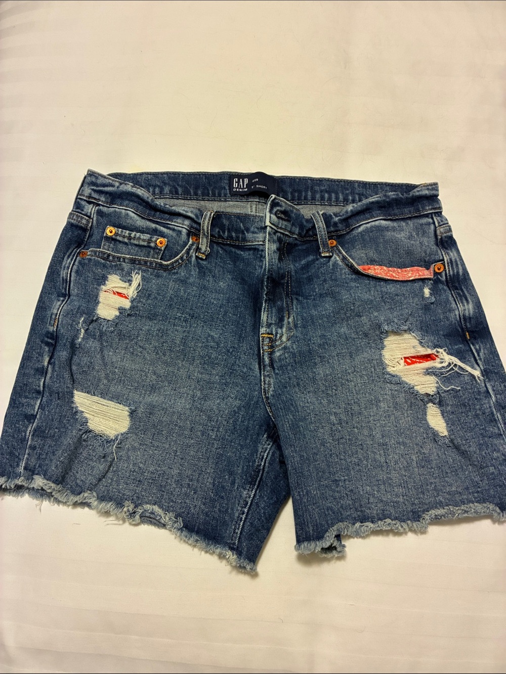 GAP Blue Ripped Denim Shorts with Red Patch Accents